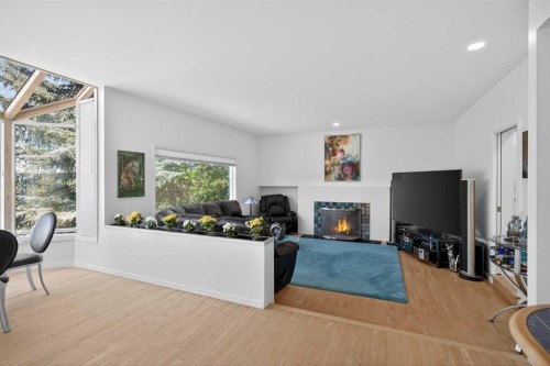 523 Scimitar Bay Nw, Calgary, AB - Indoor Photo Showing Other Room With Fireplace