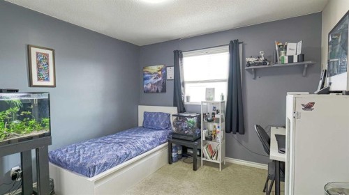 54 Saddlecreek Crescent Ne, Calgary, AB - Indoor Photo Showing Bedroom