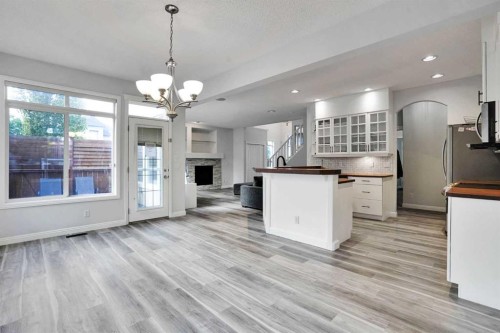 74 Cranleigh Green Se, Calgary, AB - Indoor Photo Showing Kitchen With Fireplace