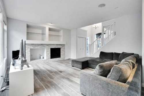 74 Cranleigh Green Se, Calgary, AB - Indoor Photo Showing Living Room With Fireplace