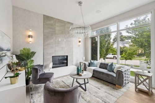 423 7A Street Ne, Calgary, AB - Indoor Photo Showing Living Room With Fireplace