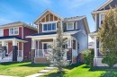 218 River Heights Green, Cochrane, AB  - Outdoor With Deck Patio Veranda With Facade 