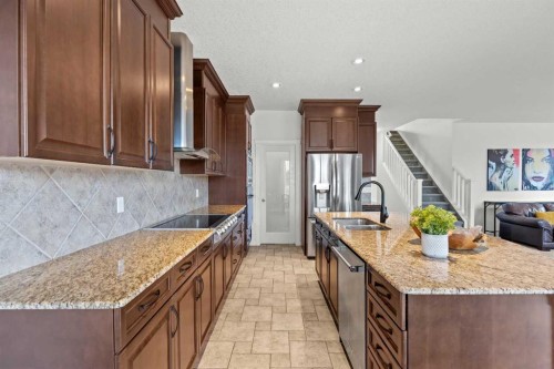318 Coopers Drive Sw, Airdrie, AB - Indoor Photo Showing Kitchen With Double Sink With Upgraded Kitchen