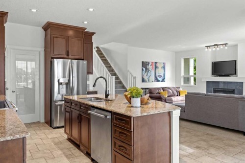 318 Coopers Drive Sw, Airdrie, AB - Indoor With Fireplace