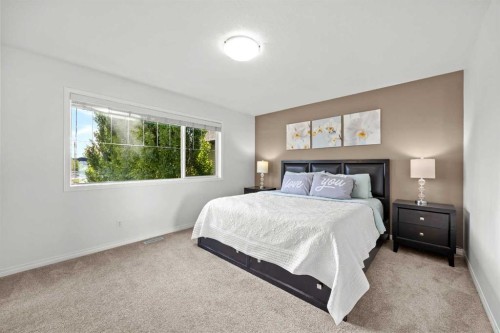 318 Coopers Drive Sw, Airdrie, AB - Indoor Photo Showing Bedroom