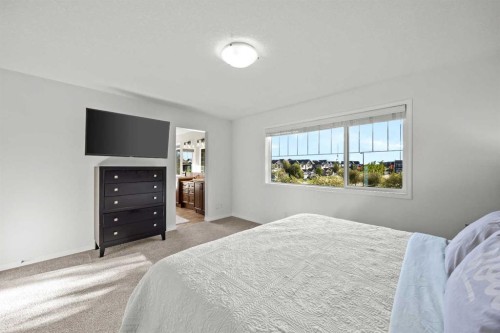 318 Coopers Drive Sw, Airdrie, AB - Indoor Photo Showing Bedroom