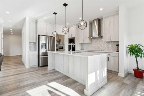51 Midgrove Drive Sw, Airdrie, AB - Indoor Photo Showing Kitchen With Upgraded Kitchen