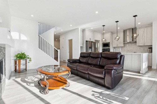 51 Midgrove Drive Sw, Airdrie, AB - Indoor Photo Showing Living Room With Fireplace