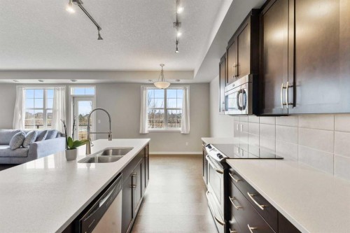 96 Cranarch Road Se, Calgary, AB - Indoor Photo Showing Kitchen With Double Sink With Upgraded Kitchen