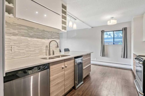 204-1512 16 Avenue Sw, Calgary, AB - Indoor Photo Showing Kitchen With Double Sink With Upgraded Kitchen