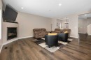 60 Chapala Square Se, Calgary, AB  - Indoor Photo Showing Living Room With Fireplace 