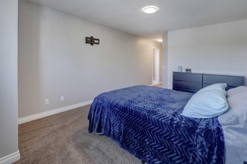 15 Parklane Drive, Strathmore, AB - Indoor Photo Showing Bedroom