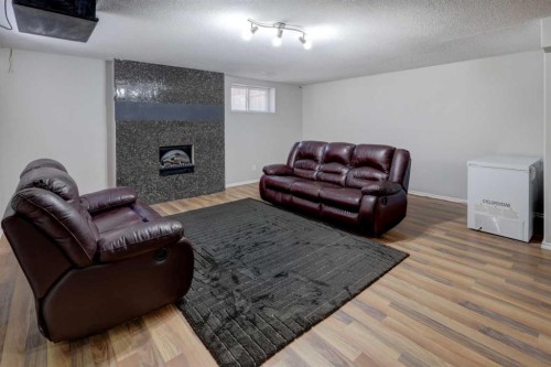 15 Parklane Drive, Strathmore, AB - Indoor Photo Showing Living Room With Fireplace