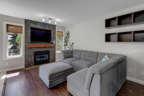 15 Parklane Drive, Strathmore, AB - Indoor Photo Showing Living Room With Fireplace