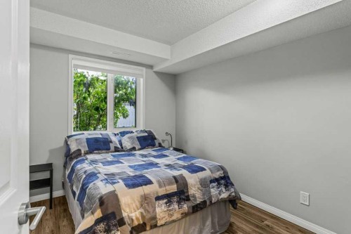 111-1206 Bow Valley Trail, Canmore, AB - Indoor Photo Showing Bedroom