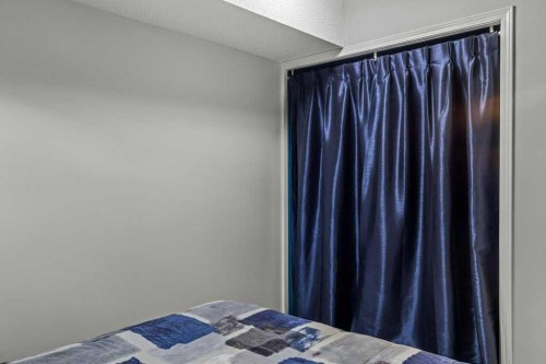 111-1206 Bow Valley Trail, Canmore, AB - Indoor Photo Showing Bedroom
