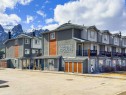 111-1206 Bow Valley Trail, Canmore, AB  - Outdoor With Facade 
