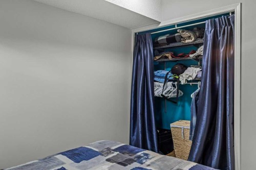 111-1206 Bow Valley Trail, Canmore, AB - Indoor Photo Showing Bedroom
