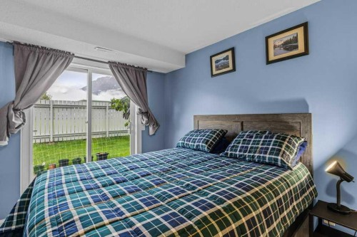 111-1206 Bow Valley Trail, Canmore, AB - Indoor Photo Showing Bedroom