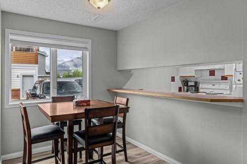 111-1206 Bow Valley Trail, Canmore, AB - Indoor Photo Showing Dining Room