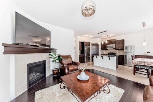 79 Cranford Green Se, Calgary, AB - Indoor Photo Showing Living Room With Fireplace