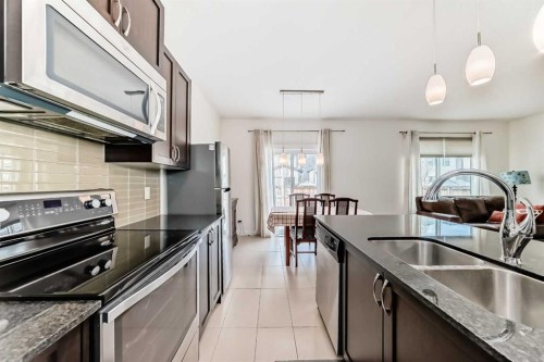 79 Cranford Green Se, Calgary, AB - Indoor Photo Showing Kitchen With Stainless Steel Kitchen With Double Sink