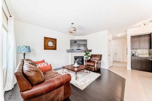 79 Cranford Green Se, Calgary, AB - Indoor Photo Showing Living Room With Fireplace