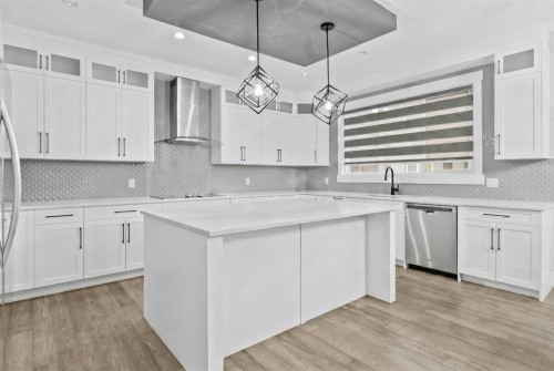 247 Kinniburgh Place, Chestermere, AB - Indoor Photo Showing Kitchen With Upgraded Kitchen