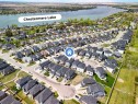 247 Kinniburgh Place, Chestermere, AB  - Outdoor With Body Of Water With View 