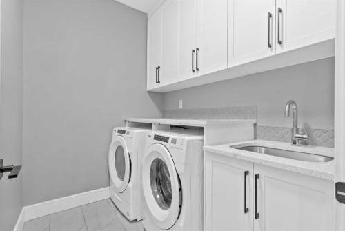247 Kinniburgh Place, Chestermere, AB - Indoor Photo Showing Laundry Room