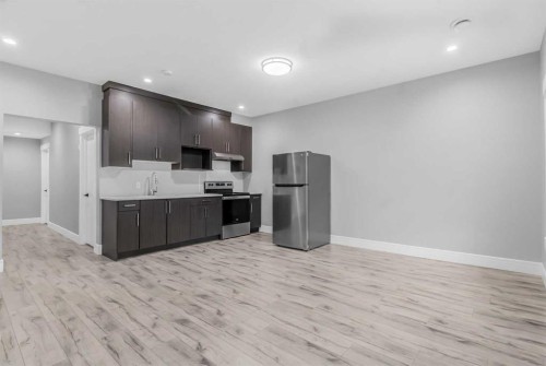 247 Kinniburgh Place, Chestermere, AB - Indoor Photo Showing Kitchen With Stainless Steel Kitchen