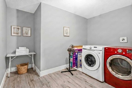 247 Kinniburgh Place, Chestermere, AB - Indoor Photo Showing Laundry Room