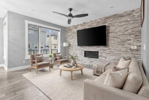 247 Kinniburgh Place, Chestermere, AB - Indoor Photo Showing Living Room With Fireplace