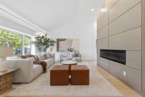 60 Lake Lucerne Close Se, Calgary, AB - Indoor Photo Showing Living Room With Fireplace