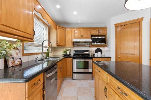 136 Schubert Hill Nw, Calgary, AB - Indoor Photo Showing Kitchen With Double Sink