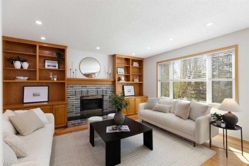 136 Schubert Hill Nw, Calgary, AB - Indoor Photo Showing Living Room With Fireplace