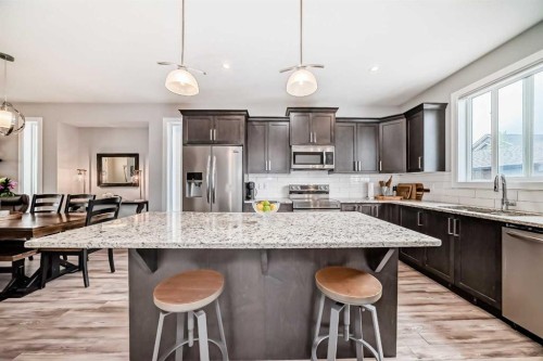 246 Cooperswood Green Sw, Airdrie, AB - Indoor Photo Showing Kitchen With Upgraded Kitchen