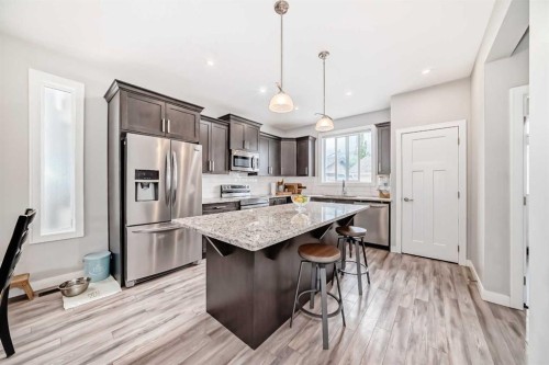 246 Cooperswood Green Sw, Airdrie, AB - Indoor Photo Showing Kitchen With Upgraded Kitchen