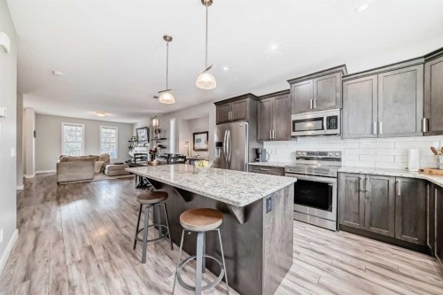 246 Cooperswood Green Sw, Airdrie, AB - Indoor Photo Showing Kitchen With Upgraded Kitchen