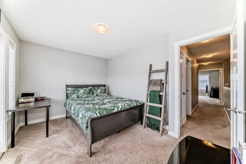 246 Cooperswood Green Sw, Airdrie, AB - Indoor Photo Showing Bedroom