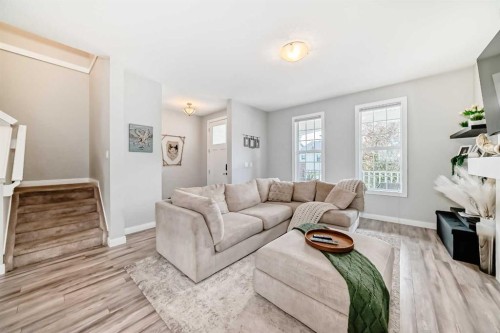 246 Cooperswood Green Sw, Airdrie, AB - Indoor Photo Showing Living Room