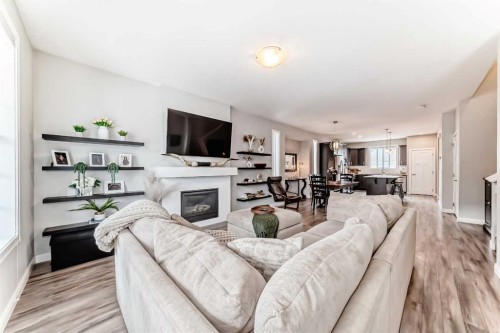 246 Cooperswood Green Sw, Airdrie, AB - Indoor Photo Showing Living Room With Fireplace