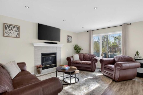 3271 Douglasdale Boulevard Se, Calgary, AB - Indoor Photo Showing Living Room With Fireplace