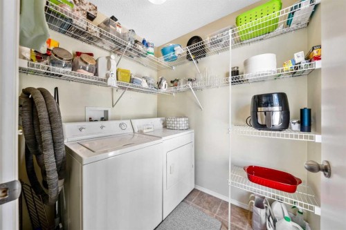 43 Toscana Gardens Nw, Calgary, AB - Indoor Photo Showing Laundry Room