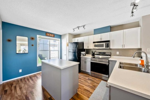 43 Toscana Gardens Nw, Calgary, AB - Indoor Photo Showing Kitchen With Double Sink