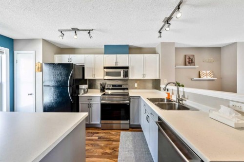 43 Toscana Gardens Nw, Calgary, AB - Indoor Photo Showing Kitchen With Stainless Steel Kitchen With Double Sink