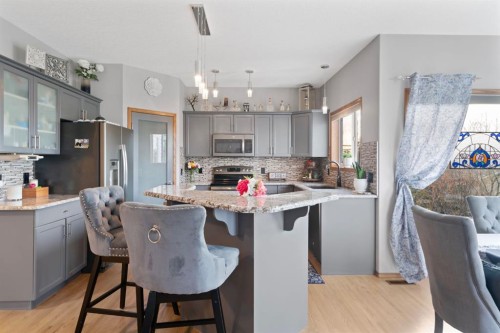 16 Bow Ridge Drive, Cochrane, AB - Indoor Photo Showing Kitchen With Upgraded Kitchen