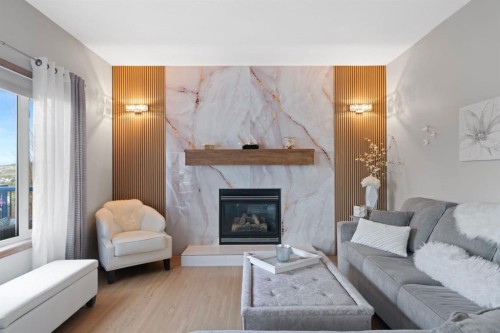 16 Bow Ridge Drive, Cochrane, AB - Indoor Photo Showing Living Room With Fireplace