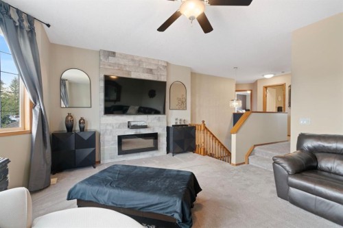 16 Bow Ridge Drive, Cochrane, AB - Indoor Photo Showing Living Room With Fireplace