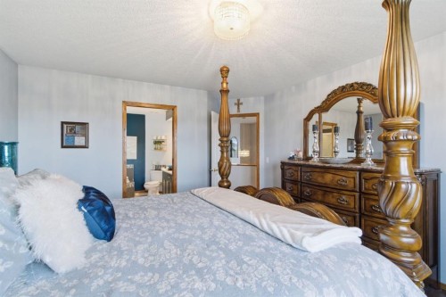 16 Bow Ridge Drive, Cochrane, AB - Indoor Photo Showing Bedroom